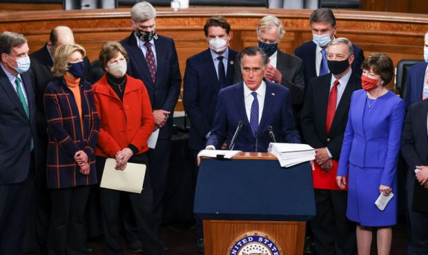 Sen. Mitt Romney (R-UT) speaks alongside a bipartisan group of Democrat and Republican members of C...