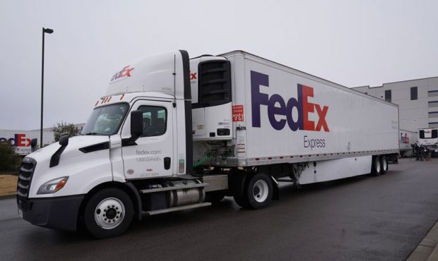 OLIVE BRANCH, MISSISSIPPI - DECEMBER 20: FedEx trucks prepare to move boxes containing the Moderna ...