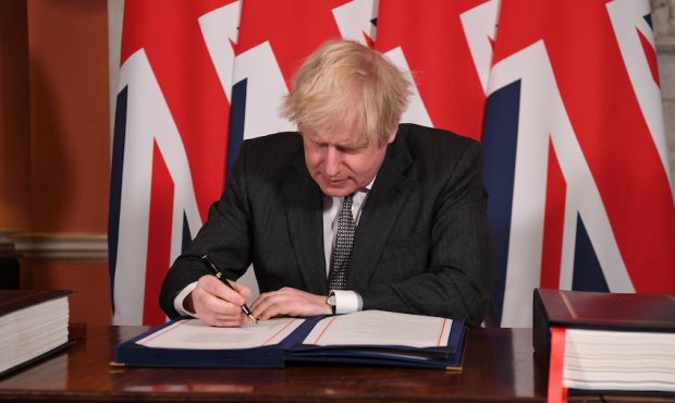 LONDON, ENGLAND - DECEMBER 30: Prime Minister, Boris Johnson signs the Brexit trade deal with the E...