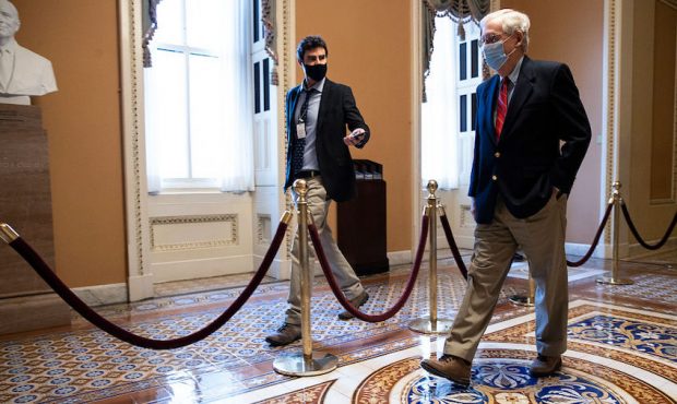 U.S. Senate Majority Leader Mitch McConnell (R-KY) walks back to his office on Capitol Hill on Dece...