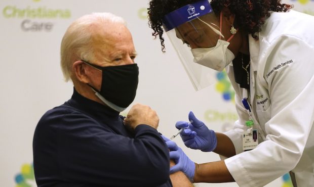 NEWARK, DE - DECEMBER 21: President-elect Joe Biden (L) receives a COVID-19 Vaccination from nurse ...