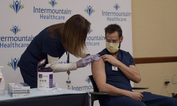 A health care worker receives a COVID-19 vaccine at Intermountain LDS Hospital. (KSL-TV)...