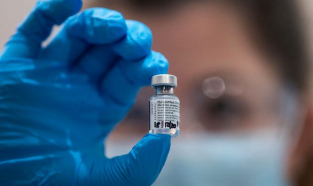 A phial of the Pfizer/BioNTech COVID-19 vaccine ready for administration at Guy's Hospital at the s...