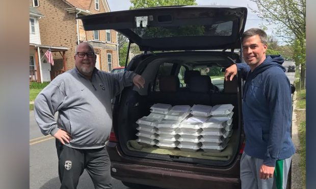 Scott McKenzie, left, and Jeremy Uhrich, have delivered over 1,500 dozen cookies to essential worke...
