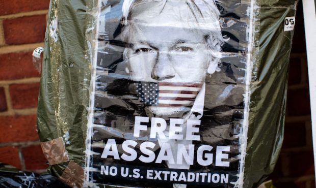 FILE: Placards and messages in support of Julian Assange sit outside Ecuadorian Embassy stands in S...