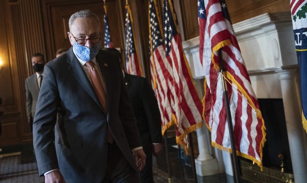 Senate Majority Leader Chuck Schumer (D-NY) speaks to reporters during a brief press availability w...