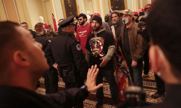 WASHINGTON, DC - JANUARY 06: Protesters interact with Capitol Police inside the U.S. Capitol Buildi...