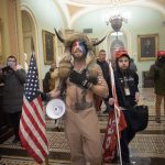 FILE: A pro-Trump mob confronts U.S. Capitol police outside the Senate chamber of the U.S. Capitol Building on January 06, 2021 in Washington, DC. (Photo by Win McNamee/Getty Images)