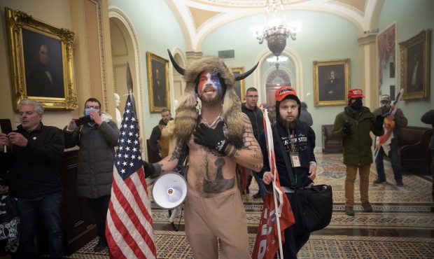 FILE: A pro-Trump mob confronts U.S. Capitol police outside the Senate chamber of the U.S. Capitol ...