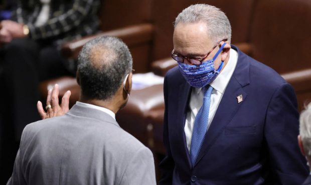 Sen. Chuck Schumer (D-NY) arrives in the House Chamber during a reconvening of a joint session of C...