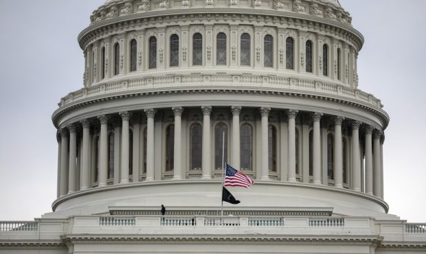 WASHINGTON, DC - JANUARY 08: The American flag flies at half-staff at the U.S. Capitol on January 0...