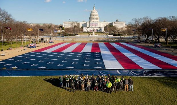The 50 Star Productions crew next to the massive American flag near the U.S. Capitol. (Kendal White...