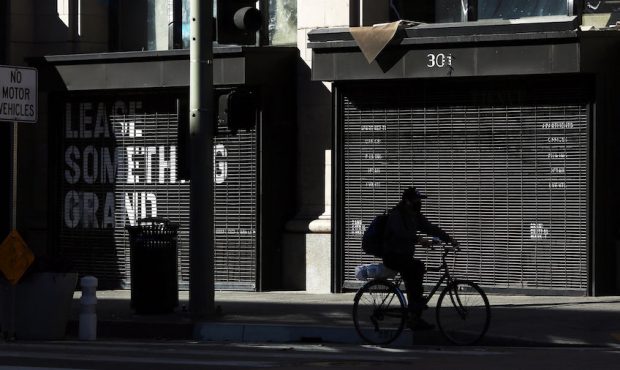 A biker passes a store for lease in downtown on Tuesday, Dec. 29, 2020 in Los Angeles, CA. Gov. Gav...