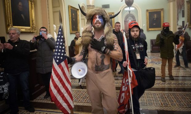 A pro-Trump mob confronts U.S. Capitol police outside the Senate chamber of the U.S. Capitol Buildi...