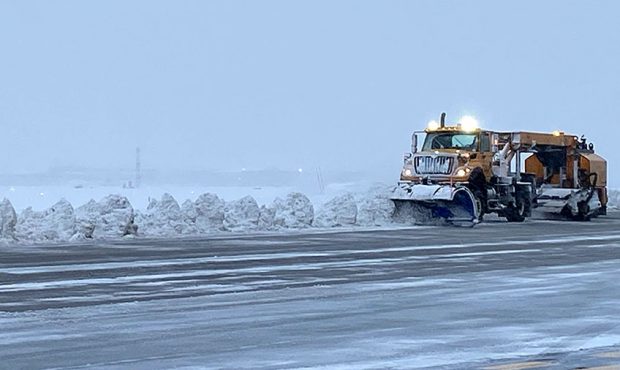 Crews work to clear snow off the runways at Salt Lake International Airport on Wednesday, Feb. 17, ...