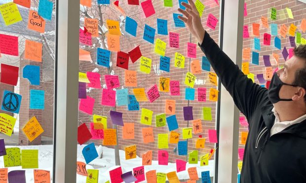 Granger High School principal David Dunn shows off a window that is covered with sticky notes that ...