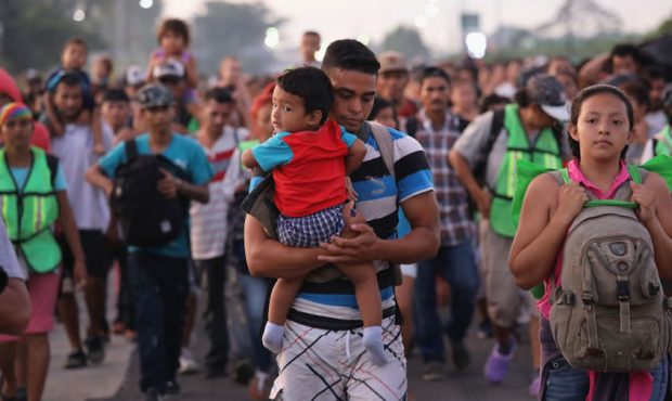 FILE: A caravan of thousands of Central Americans travel toward the United States in 2018. (Photo b...