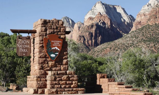 A sign hangs at the  entrance to Zion National Park on May 14, 2020 in Springdale, Utah. (Photo by ...
