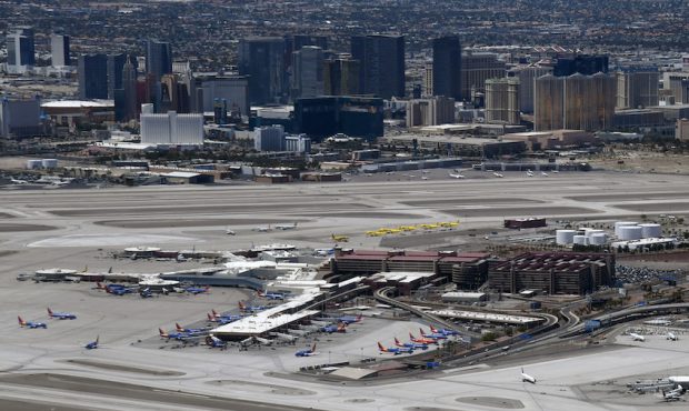 An aerial view shows hotel-casinos on the Las Vegas Strip behind McCarran International Airport ami...
