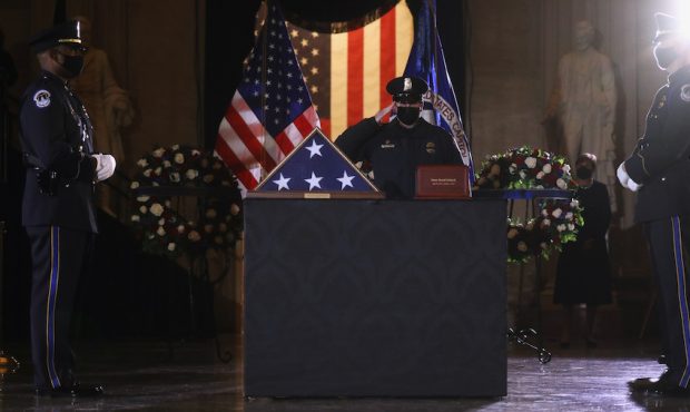 U.S. Capitol Police Officers pay their respects to fellow officer Brian Sicknick, who died from inj...