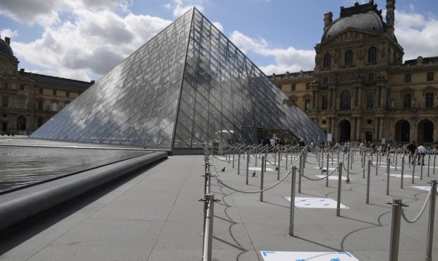 Social distancing marks are seen on the floor outside the Louvre museum as it reopens its doors fol...