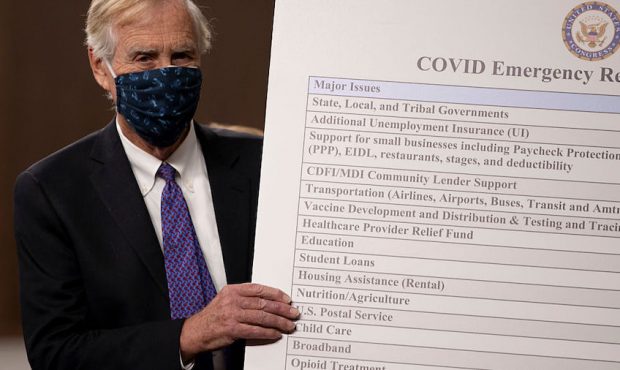 FILE: Sen. Angus King (I-ME) sets up a sign  alongside a bipartisan group of Democrat and Republica...
