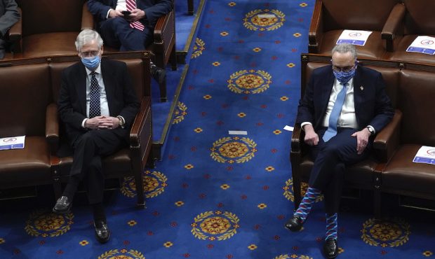 U.S. Senate Majority Leader Mitch McConnell (L) (R-KY) looks on with U.S. Senate Minority Leader Ch...