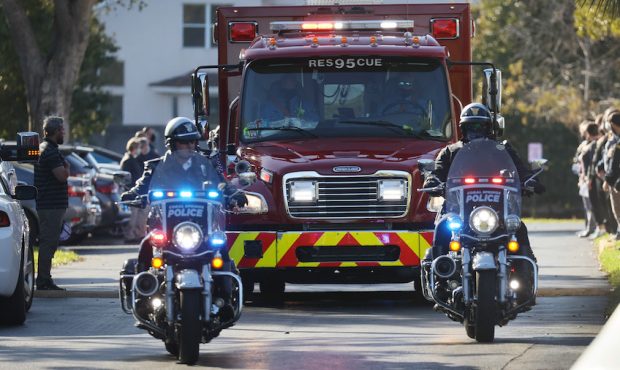 Broward County Sheriff escort a Coral Springs Parkland Fire Department vehicle as it leaves the Bro...