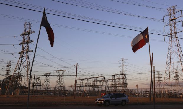 Texas flags fly near an electrical substation on February 21, 2021 in Houston, Texas. Millions of T...