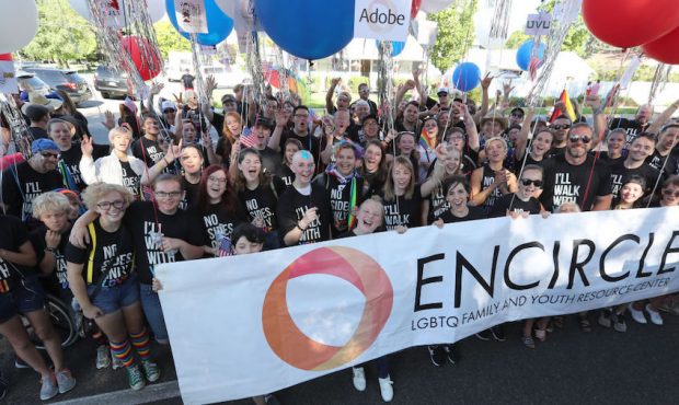 Members of the LGBT youth support group "Encircle",  pose for a picture after their historic march ...
