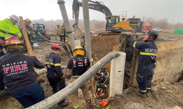 Rescuers respond to partial trench collapse in Riverton that buried a man up to his elbows in Febru...