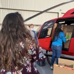 Volunteers prepare for a helicopter flight to deliver supplies to a remote community in Arizona. (Photo: Andrew Adams, KSL TV)