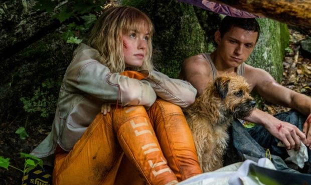 Daisy Ridley as Viola Eade, Manchee the dog, and Tom Holland as Todd Hewitt in "Chaos Walking" (Pho...