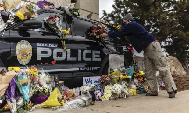 Mourners pay their respects to Officer Eric Talley, who was killed after a gunman opened fire at a ...