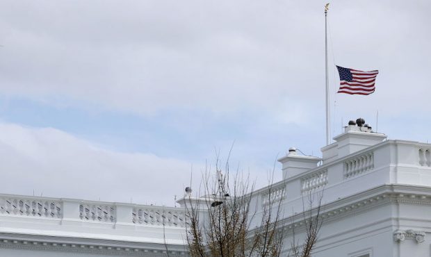 The American flag flies at half-staff at the White House in honor of the victims of Monday's mass s...