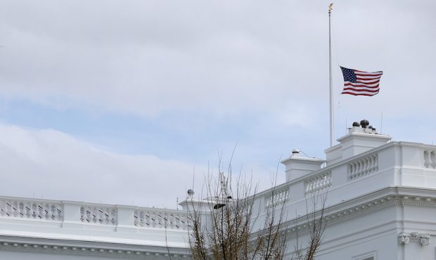 The American flag flies at half-staff at the White House in honor of the victims of Monday's mass s...