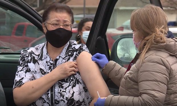 Woman gets vaccinated at UPIHC drive-thru clinic. (KSL TV)...