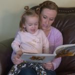 Nichelle Allred reads with her two-year-old daughter, Madeline. Reading to a child is on the of the five basic brain building principles in the 5B45 initiative. (KSL TV)