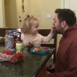 : Travis Allred eats a snack and plays with his daughter Madeline as they count the number of grapes they are eating. Allred is also the Early Learning Project Manager at Envision Utah and know the importance of brain building at a young age. (KSL TV)