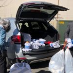 Governor Spencer Cox and Homeless Pamela Atkinson dropped off donations at the Midvale Family Resource Center, operated by the Road Home. (KSL TV)