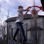 Grant Brady, 13, dunks a basket while playing a game of PIG with his brothers. After doing allergy immunotherapy shots for five years, his allergies have improved significantly and now the tree pollens and grasses don't affect him as much. (KSL TV)