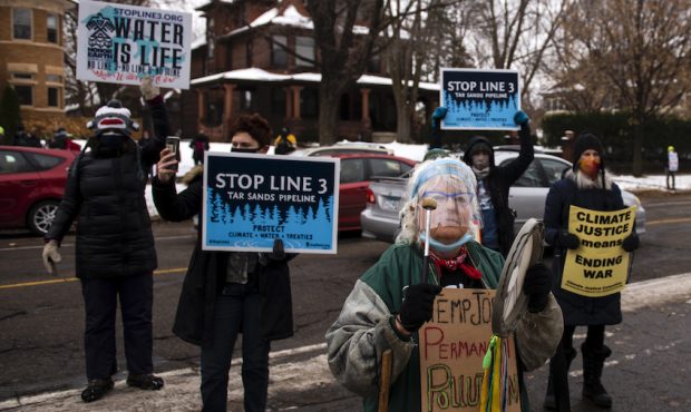 FILE: People protest against the Enbridge Energy Line 3 oil pipeline project outside the Governor's...