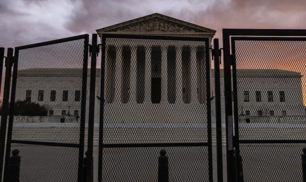 FILE: Security fencing surrounds the U.S. Supreme Court which is adjacent to the U.S. Capitol on th...
