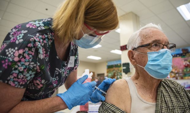 Rene Neira receives his Moderna COVID-19 vaccine at a vaccination site at a senior center on March ...