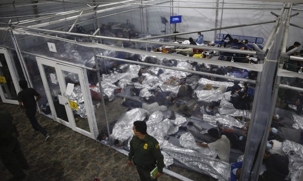 Young children lie inside a pod at the Department of Homeland Security holding facility run by the ...