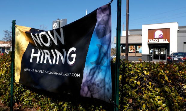 FILE: A now hiring sign in posted in front of a Taco Bell restaurant on February 05, 2021 in Novato...