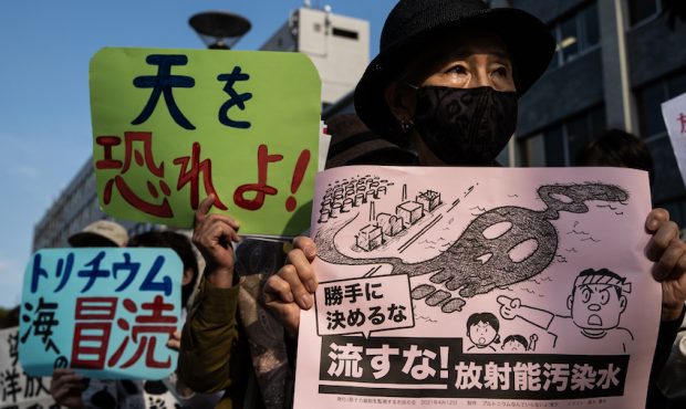 People demonstrate outside of the Prime Minister's official residence on April 12, 2021 in Tokyo, J...