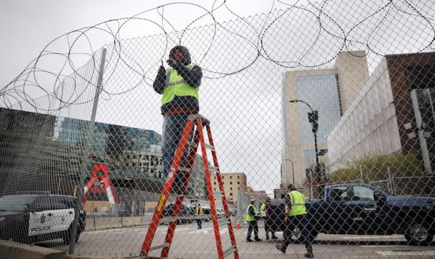 Workers fortify government buildings downtown as the city prepares for possible unrest following th...