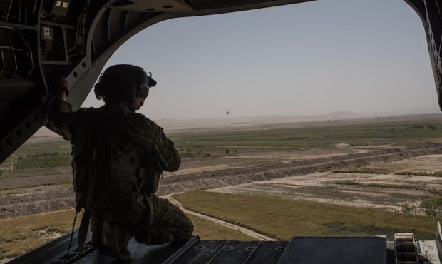 FILE: A U.S. Army helicopter flies from Camp Shorab to Camp Bost on Sept. 11, 2017, in Helmand Prov...