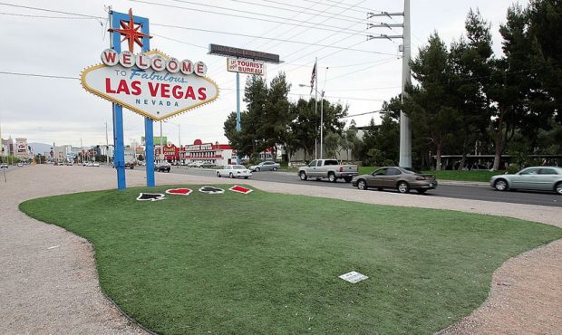 New artificial turf adorns the area around the famous sign welcoming motorists at the south end of ...